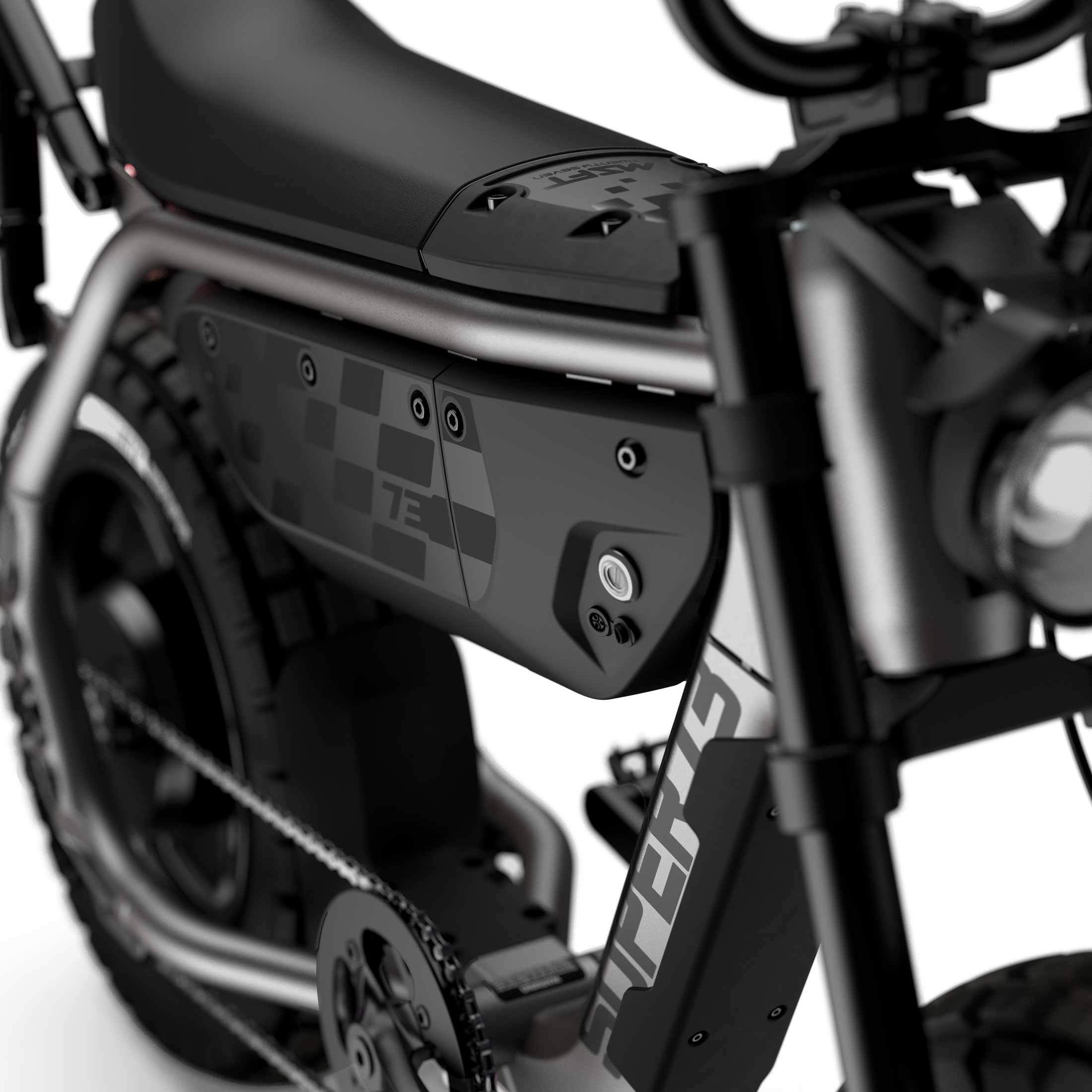Close up of the seat and battery compartment with branded decals on the SUPER73-MZFT ebike in Titanium Ore.